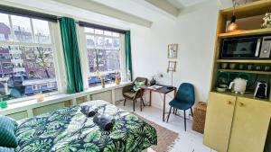a bedroom with a dog sleeping on a bed at JoyJoyJoy the Green Palm ecolicious studio in a in historic Canalhouse from 1729 with view on the canals in Amsterdam