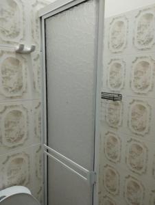 a shower stall with a glass door in a bathroom at Hotel Casa Real Málaga Santander in Málaga