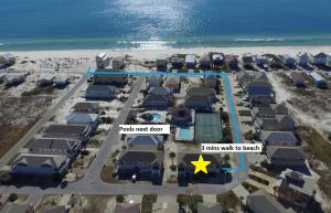 arial view of a resort with a view of the beach at Gulf Shores Haven Pools Tent Tiki Bar Games Pool Table Early Checkin in Gulf Shores +46 photos