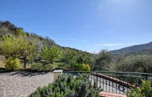 a view of a walkway with a mountain in the background at Casa L'uliveto in Moneglia
