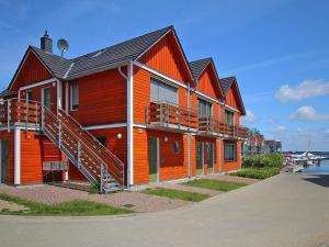a large building with orange paint on it at Apartment by Lake Plau with Stunning Views in Plau am See