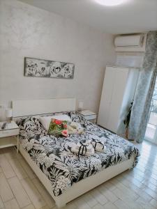 Postel nebo postele na pokoji v ubytování B&B La Palmetta