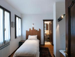 Tempat tidur dalam kamar di Bed & breakfast Villa Lisetta