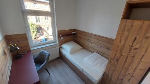 Ένα ή περισσότερα κρεβάτια σε δωμάτιο στο Ferienwohnung klimatisiert in Stadtfeld West +3 φωτογραφίες