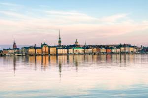 a view of a city across the water at Hotell Skeppsbron in Stockholm