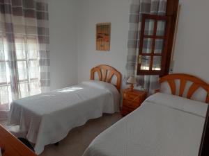 Postel nebo postele na pokoji v ubytování AMPLIO CHALET CON GRAN PISCINA