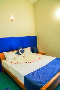 Postel nebo postele na pokoji v ubytování Reheboth Hotel