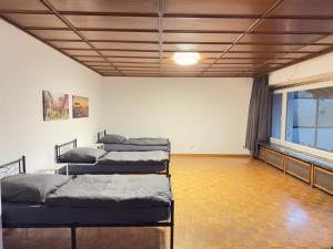a room with three bunk beds in it at Easy Stay Leverkusen in Leverkusen