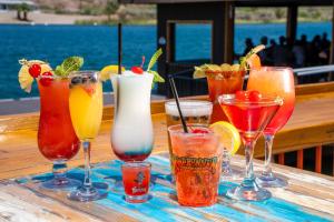 a group of different types of drinks on a table at Blue Bliss at Roadrunner Resort in Parker +2 photos