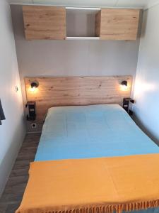Katil atau katil-katil dalam bilik di Mobile home MIÊLLE