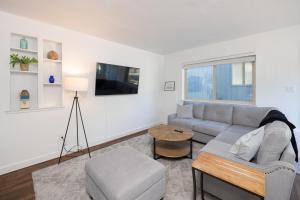 a living room with a couch and a table at Cozy One-Bedroom Coastal Retreat - Walk to Beach in El Granada