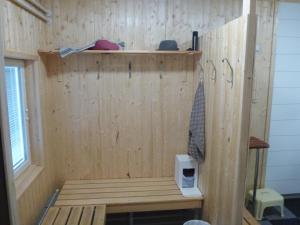 a wooden sauna with a bench in a room at Vuotson Maja B&B in Vuotso +85 photos