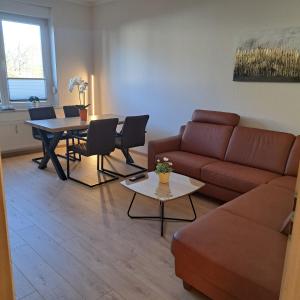 a living room with a couch and a table at Ferienwohnung Reichel in Freiberg
