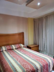 Katil atau katil-katil dalam bilik di Hotel Posada de Santiago