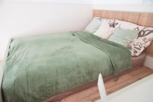 Postel nebo postele na pokoji v ubytování Nagymaros Apartman