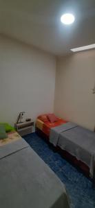 a room with two beds in a room at Puñadito de Descanso B in Salta