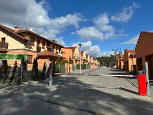a street with a fence and some houses at Apartament Pod Żaglami 4 in Sława