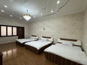 Ένα ή περισσότερα κρεβάτια σε δωμάτιο στο Hello Dushanbe Hostel