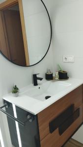 a bathroom with a sink and a mirror at Home St Nicolas Home VUT42/000161 in Soria +22 photos