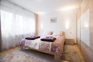 Postel nebo postele na pokoji v ubytování Apartment Max