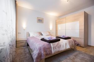 Postel nebo postele na pokoji v ubytování Apartment Max