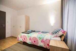 Postel nebo postele na pokoji v ubytování Apartment Max