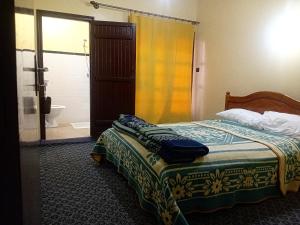 Postel nebo postele na pokoji v ubytování Hotel Almanader