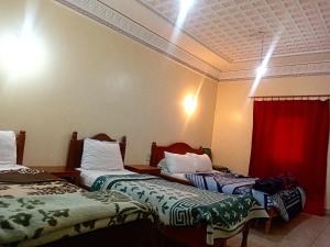Postel nebo postele na pokoji v ubytování Hotel Almanader