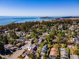 an aerial view of a town with houses and the ocean at Cozy One-Bedroom Coastal Retreat - Walk to Beach in El Granada