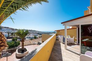 a balcony of a house with a view of the ocean at Ines Luxury Costa Adeje in Adeje