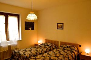 Ένα ή περισσότερα κρεβάτια σε δωμάτιο στο Albergo Di Murlo