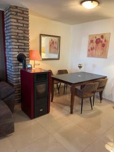 a living room with a dining room table and a table and chairs at Villa Yari-Dog Friendly, Private Jaccuzzi&Sauna,Shared Infinity Pool, Sea View in Lovran