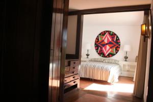 Giường trong phòng chung tại Herdade AMÁLIA RODRIGUES