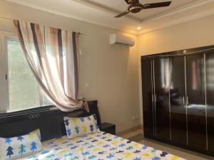 Ένα ή περισσότερα κρεβάτια σε δωμάτιο στο Kfam04 Apartments