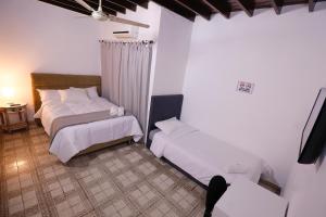Vuode tai vuoteita majoituspaikassa Habitación privada con WiFi, desayuno y excelente ubicación en Asunción