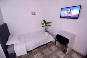 TV tai viihdekeskus majoituspaikassa Habitación privada con WiFi, desayuno y excelente ubicación en Asunción