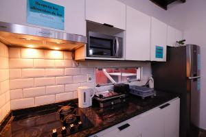 Kuchnia lub aneks kuchenny w obiekcie Habitación privada con terraza y WiFi rápido en el centro