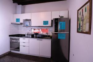 Kuchnia lub aneks kuchenny w obiekcie Habitación privada con terraza y WiFi rápido en el centro