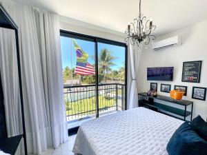 a bedroom with a bed and a large window at Fletcher American Manor Hotel & Resort in Prado +137 photos