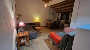 a living room with a couch and a table at La Replaceta in Segorbe