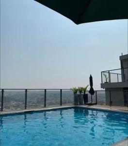 a large swimming pool on top of a building at SkyLuxe Studio 2 with rooftop Pool & Self Check In in Islamabad