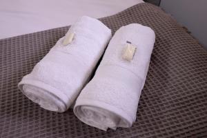 Habitación céntrica con desayuno y baño privadoにあるベッド