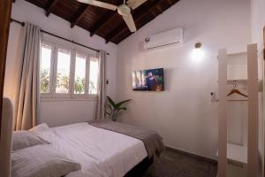 Habitación céntrica con desayuno y baño privadoにあるベッド
