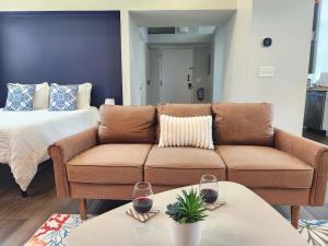 a living room with a couch and a bed at Jennifer's Historic Downtown Loft in Providence +12 photos
