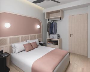 Voodi või voodid majutusasutuse The Initial Sama Serviced Residences toas