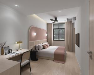 Voodi või voodid majutusasutuse The Initial Sama Serviced Residences toas