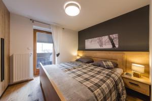 Łóżko lub łóżka w pokoju w obiekcie Luxury Chalet Mallnitz