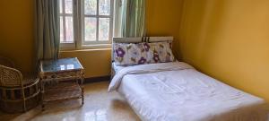 Postel nebo postele na pokoji v ubytování Heritage View Homestay