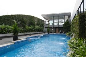a swimming pool in the middle of a building at The Premiere Pekanbaru in Pekanbaru
