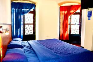 Postel nebo postele na pokoji v ubytování Hostal History